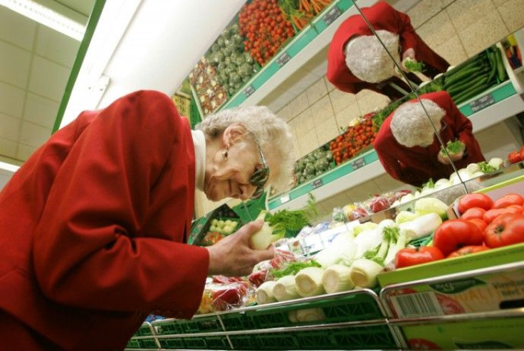 Elderly German Christine Evelt, 78, who is visually impaired, shops for groceries at her local store in the northern town of Greven 
