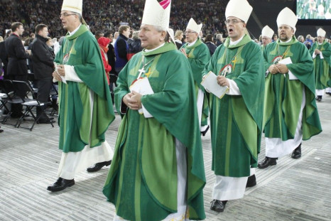 The clergy leaves after the Eucharist led by Pope Benedict XVI at the Olympic stadium in Berlin