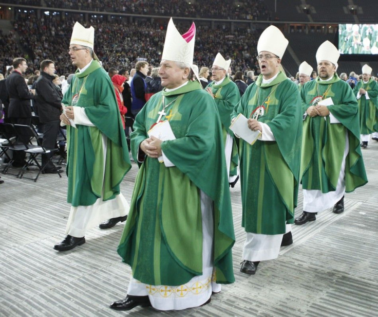 The clergy leaves after the Eucharist led by Pope Benedict XVI at the Olympic stadium in Berlin