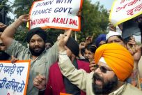 Members of National Akali Dal, a regional Sikh political party, shout anti-French slogans during a protest in New Delhi