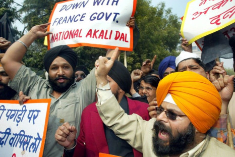 Members of National Akali Dal, a regional Sikh political party, shout anti-French slogans during a protest in New Delhi