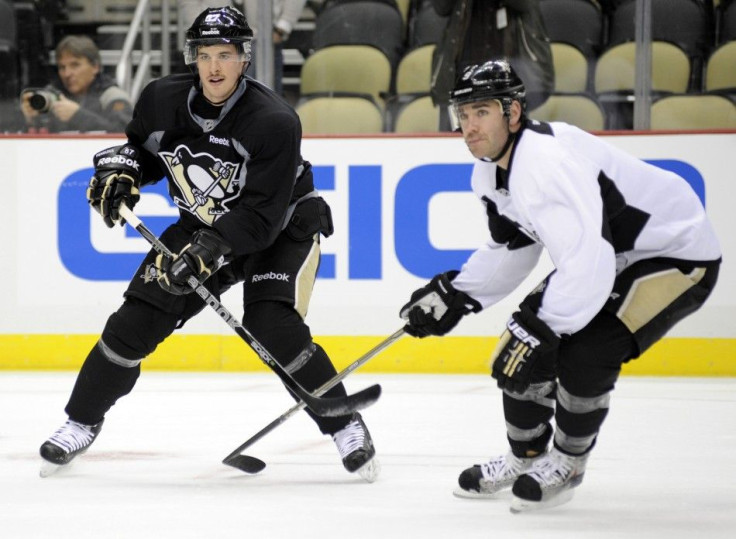 Penguins&#039; Crosby participates in the &quot;morning skate&quot; with Dupuis in preparation for Crosby&#039;s return to action Monday night against the New York Islanders in Pittsburgh