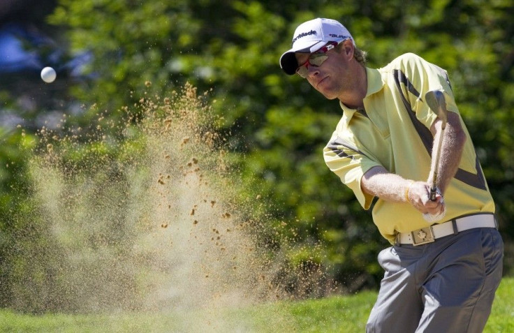 David Hearn of Canada hits out of the bunker at the fifth hole during the Canadian Open Golf Tournament at Shaughnessy Golf and Country Club in Vancouver