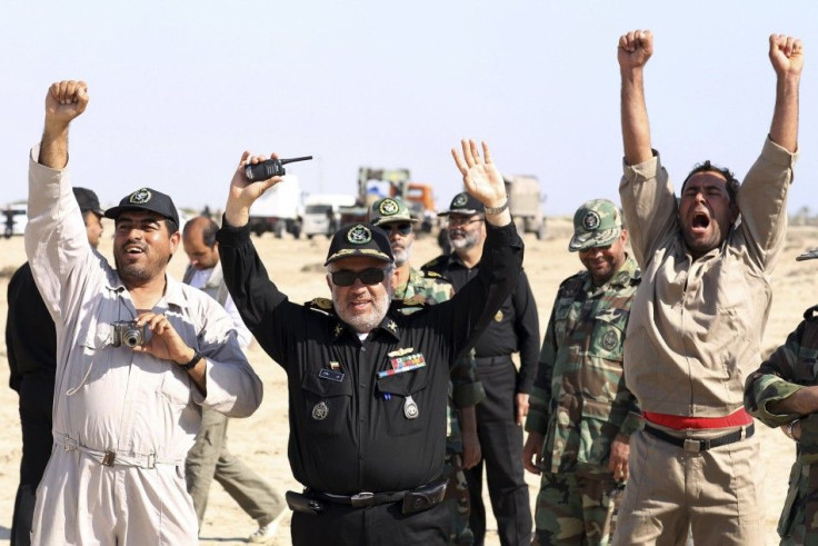 Members of Iran's Navy cheer after launching a long-range shore-to-sea missile called Qader (Capable) during the Velayat-90 war game on the Sea of Oman's shore near the Strait of Hormuz in southern Iran on Jan. 2, 2012.