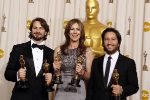 Best motion picture winners Mark Boal, left, Kathryn Bigelow, and Greg Shapiro of the film &quot;The Hurt Locker,&quot; display their Oscars at the 82nd Academy Awards in Hollywood, Calif., on March 7, 2010.