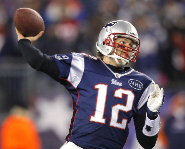 New England Patriots quarterback Tom Brady throws a pass against the Denver Broncos during the third quarter of their NFL AFC Divisional playoff game in Foxborough, Massachusetts, January 14, 2012.