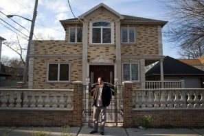 Hakan Tale stands outside his house in Staten Island, New York, December 9, 2011.