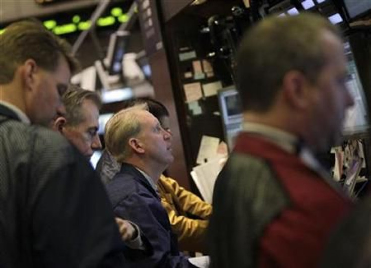 Traders work on the floor of the New York Stock Exchange