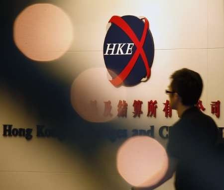 A man walks into the trading hall of the Hong Kong Exchanges and Clearing in front of Christmas lighting in Hong Kong - file photo.