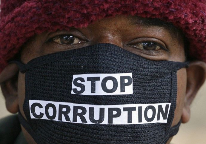 Chaudhary an employee of telecom operator systems takes part in a silent protest against the telecom corruption scandal in New Delhi