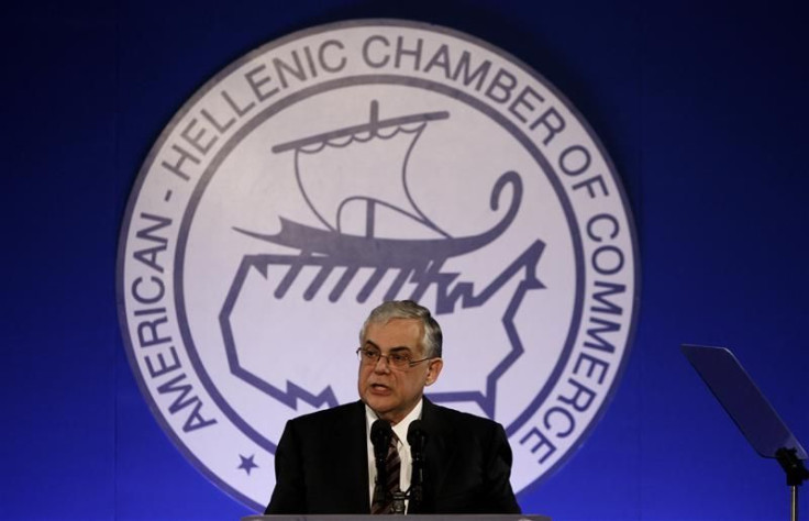 Greece&#039;s Prime Minister Papademos addresses the audience during an economic conference in Athens