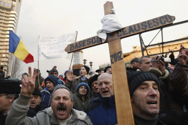 People shout slogans during a protest against Romania&#039;s President Basescu at the University Square in Bucharest
