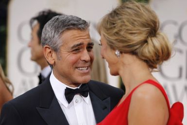 Actor George Clooney from the film &quot;The Descendants&quot; and &quot;The Ides of March&quot; and girlfriend Stacy Keibler arrive at the 69th annual Golden Globe Awards in Beverly Hills