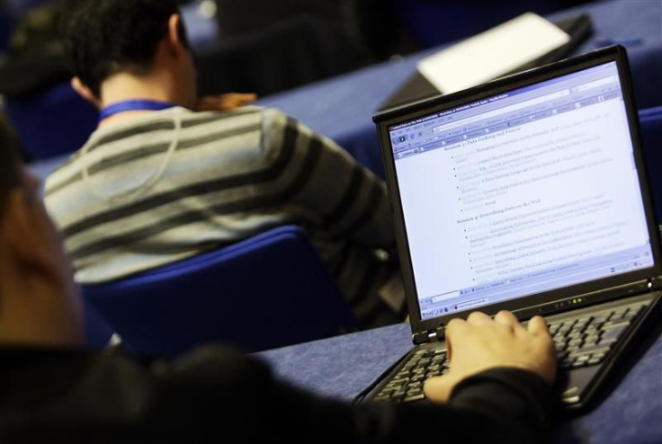 People attend a workshop on the first day of the 18th World Wide Web Conference in Madrid