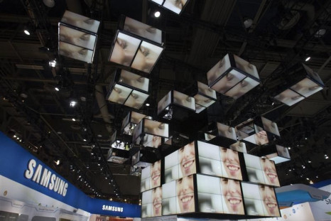 Video monitors are shown the Samsung Electronics booth at the 2012 International Consumer Electronics Show (CES) in Las Vegas