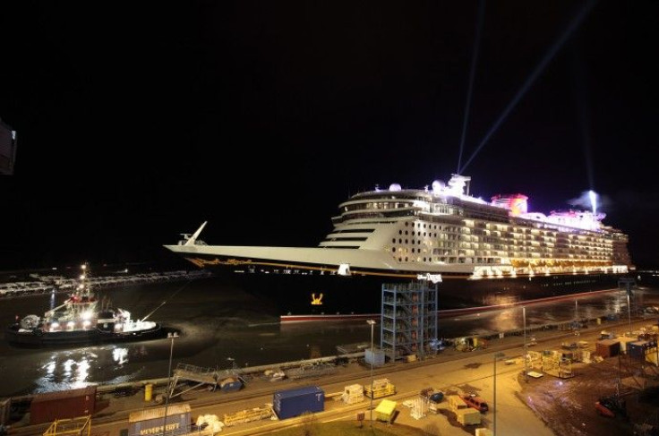 New cruise ship Disney Dream passes floodgate to the Ems river as it leaves Meyer shipjard in Papenburg