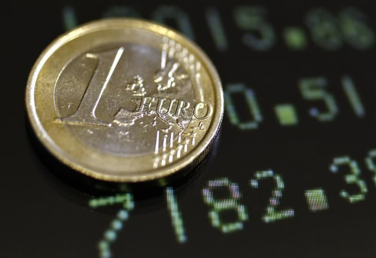 Picture illustration shows a one euro coin on a flat screen displaying exchange rates in Rome