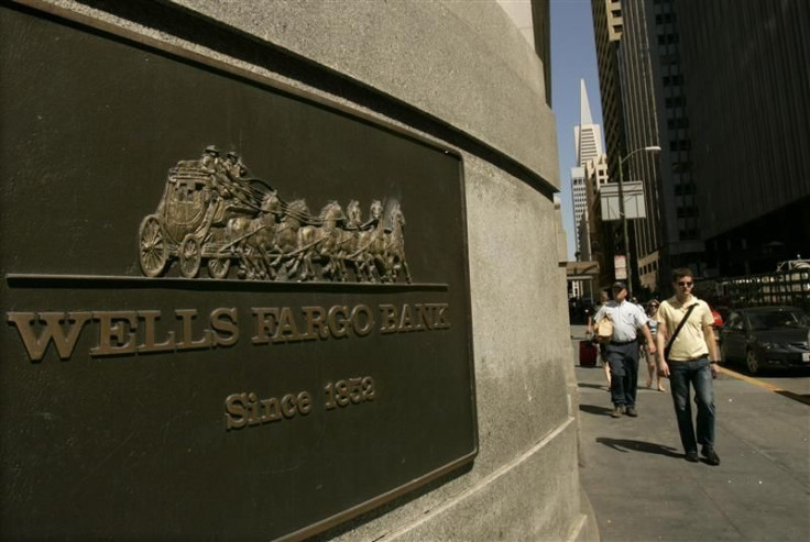 A pedestrian walks past a Wells Fargo & Co bank in San Francisco