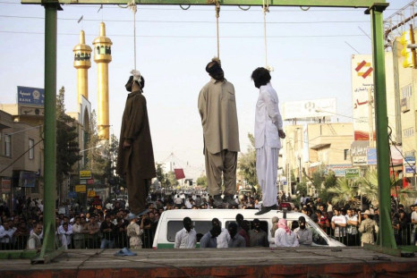 Three men hung in a public square in Iran.