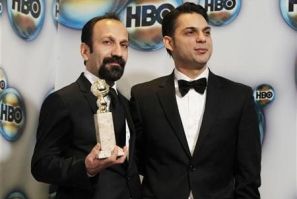 Director Asghar Farhadi (L) and actor Peyman Moadi pose with the award for best foreign film for &#039;&#039;A Separation&#039;&#039; as they arrive at the HBO after party after at the 69th annual Golden Globe Awards in Beverly Hills, California
