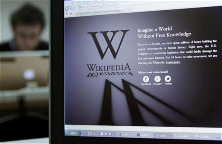 A reporter&#039;s laptop shows the Wikipedia blacked out opening page in Brussels