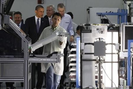 U.S. President Barack Obama (2nd L) tours a North Carolina manufacturing facility of energy efficient LED lights, Cree Inc., in Raleigh-Durham, June 13, 2011.