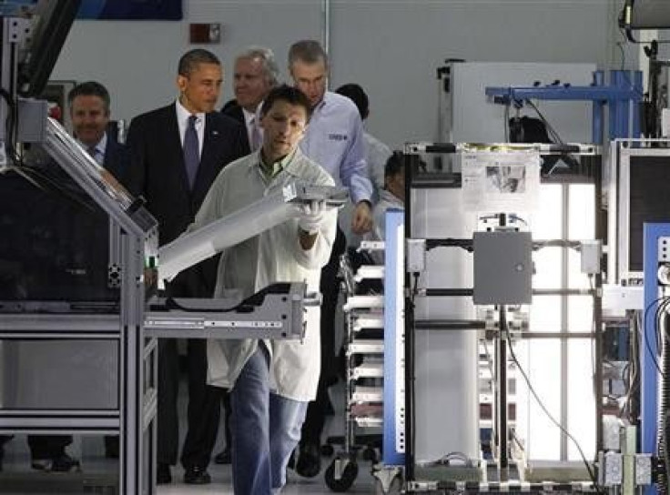 U.S. President Barack Obama (2nd L) tours a North Carolina manufacturing facility of energy efficient LED lights, Cree Inc., in Raleigh-Durham, June 13, 2011.