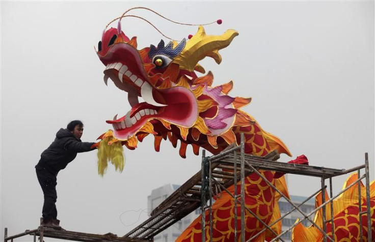 Worker installs dragon decoration for upcoming Chinese Lunar New Year in Wuhan.
