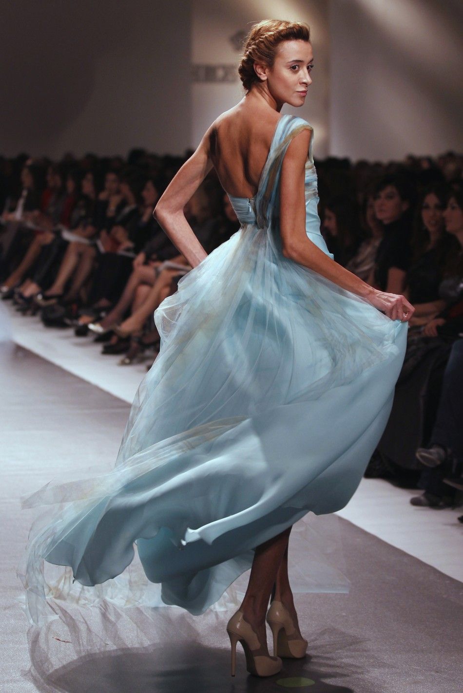 A model presents a creation by Lebanese designer Georges Chakra for his collection of Spring Summer 2012,during a fashion show in Beirut January 18, 2012.