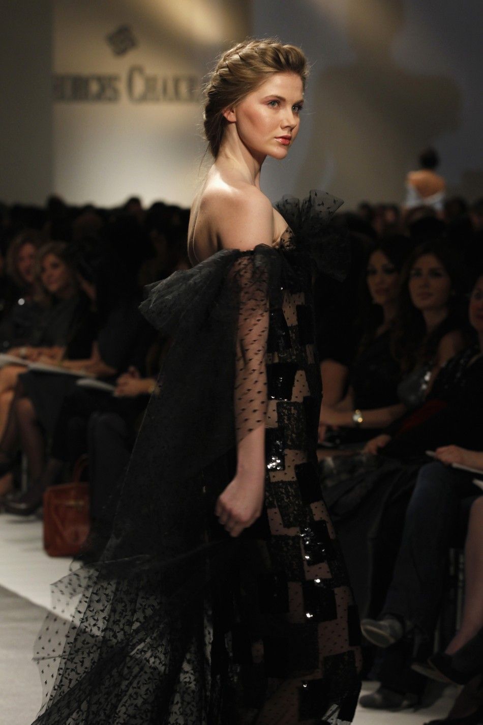 A model presents a creation by Lebanese designer Georges Chakra for his collection of Spring Summer 2012,during a fashion show in Beirut January 18, 2012.