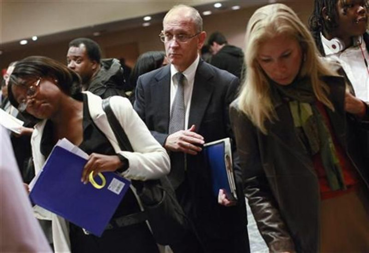 A man waits to speak with a job recruiter during a job fair in New York