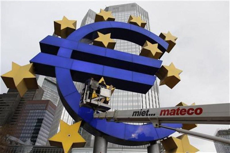 Workers maintain the huge Euro logo in front headquarters of ECB in Frankfurt