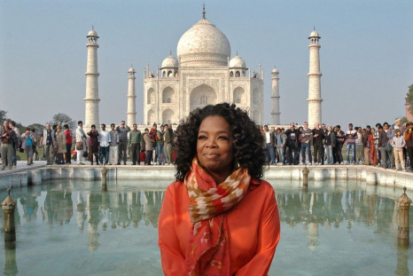 Entertainment host Oprah Winfrey poses for pictures in front of the historic Taj Mahal during her visit to the northern Indian city of Agra