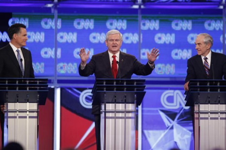 Republican presidential candidate Gingrich speaks as Romney and Paul look on during the Republican presidential candidates debate