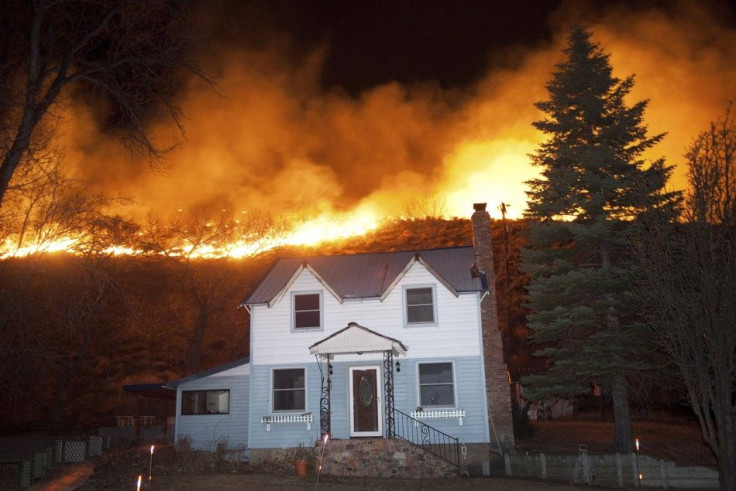 A home along Highway 395 stands in the path of the Washoe Drive fire in Washoe City