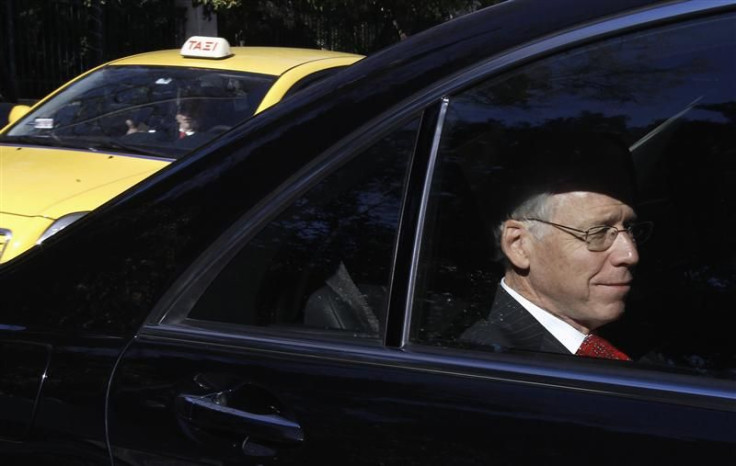 Head of IIF Dallara enters Greek Prime Minister's office in a car in Athens