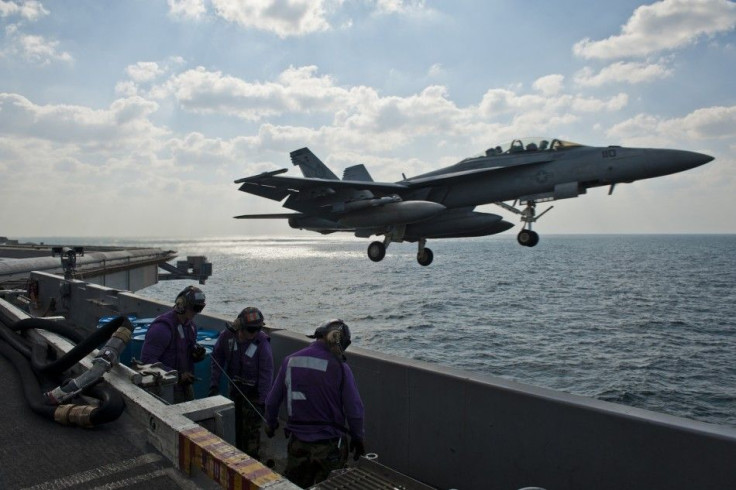 An F/A-18F fighter jet launches off the aircraft carrier USS John C. Stennis during maneuvers in the Arabian Gulf in this U.S. Navy handout photo dated Nov. 23, 2011