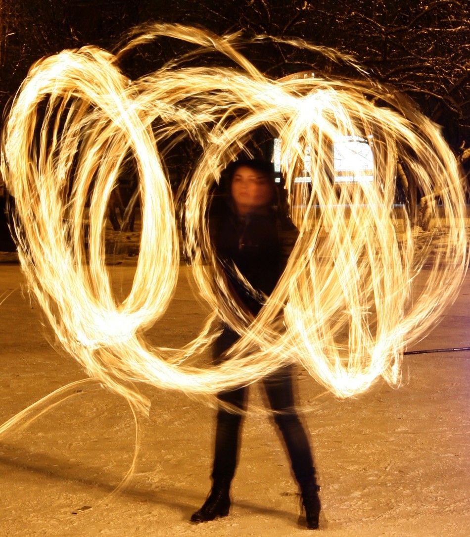 An amateur artist performs a fire show to celebrate the Chinese Lunar New Year in Russias Siberian city of Krasnoyarsk 