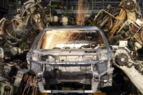 Robots weld the bodyshell of a Toyota Camry Hybrid car on the assembly line at the Toyota plant in Melbourne