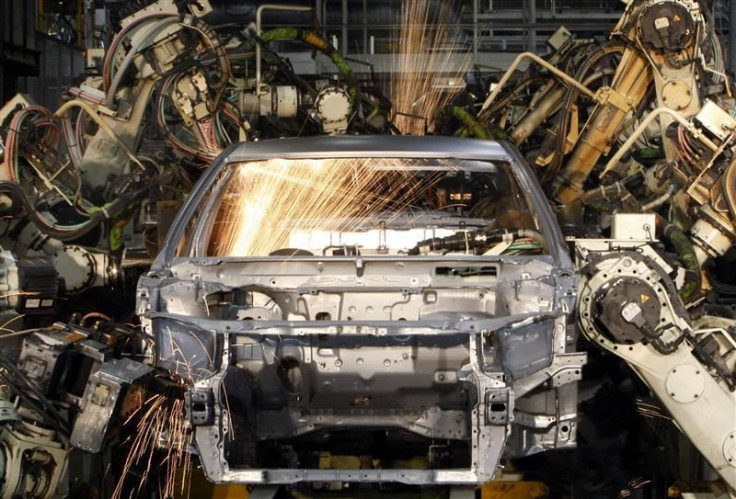 Robots weld the bodyshell of a Toyota Camry Hybrid car on the assembly line at the Toyota plant in Melbourne