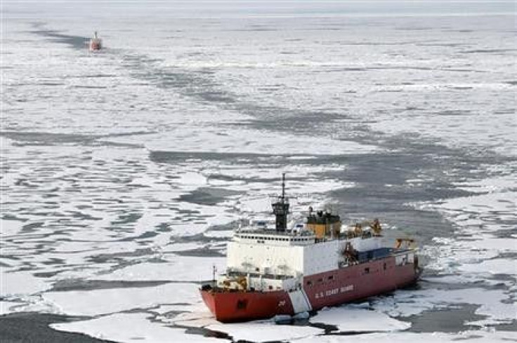 The Coast Guard Cutter Healy breaks ice ahead of the Canadian Coast Guard Ship Louis S. St-Laurent during an Arctic expedition, in this August 24, 2009 handout photo.