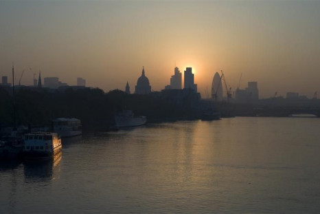 The sun rises above the financial district of the City of London