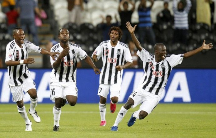 Kasusula of Congo's TP Mazembe celebrates with teammates after their Club World Cup semi-final soccer match against Brazil's Internacional at Mohammed Bin Zayed Stadium in Abu Dhabi.