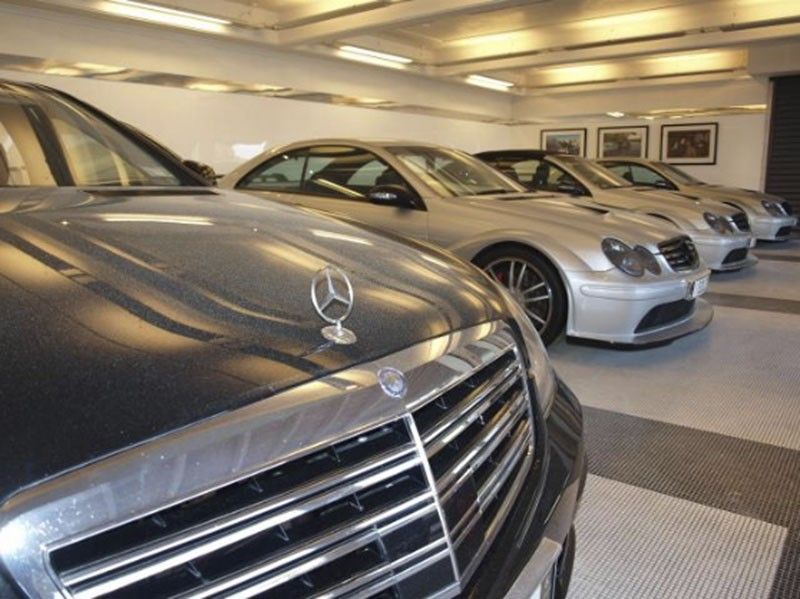 Handout pictures of several Mercedes vehicles at the Auckland residence of Dotcom