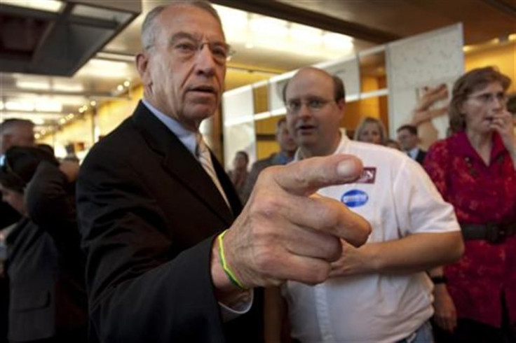 Chuck Grassley talks to supporter Allan Frandson in Des Moines, Iowa.