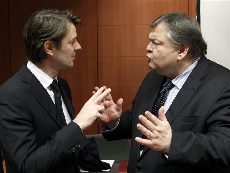 Francois Baroin talks with Evangelos Venizelos at a Eurogroup meeting at the European Union council headquarters in Brussels