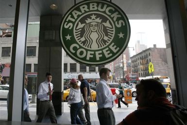 File photo of people walking past the Starbucks outlet on 47th and 8th Avenue in New York