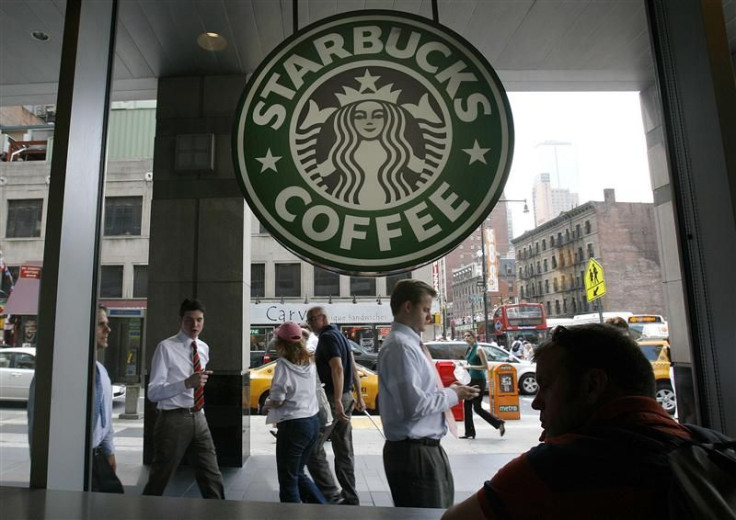 File photo of people walking past the Starbucks outlet on 47th and 8th Avenue in New York