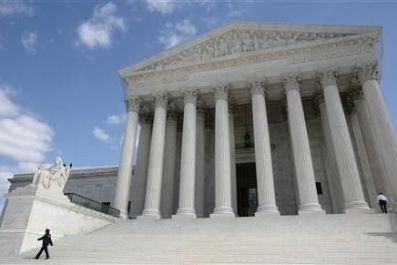 Security guards walk the steps of the Supreme Court in Washington, October 1, 2010.