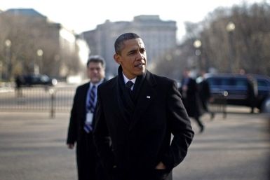 U.S. President Barack Obama walks out of the White House to cross Pennsylvania Avenue to meet with business leaders at Blair House in Washington, December 15, 2010. 